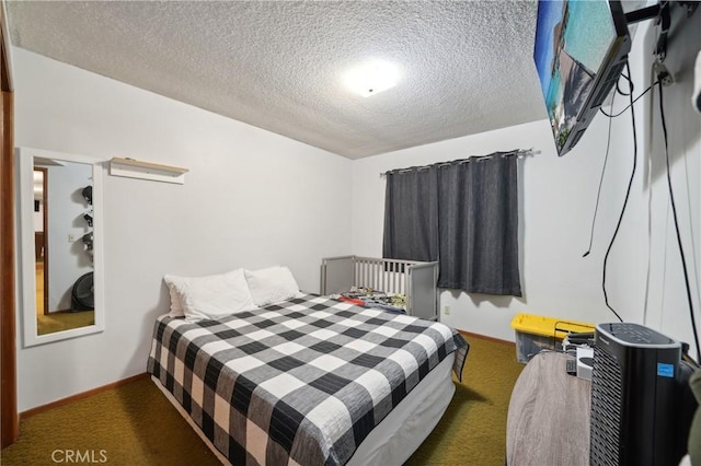 carpeted bedroom with a textured ceiling