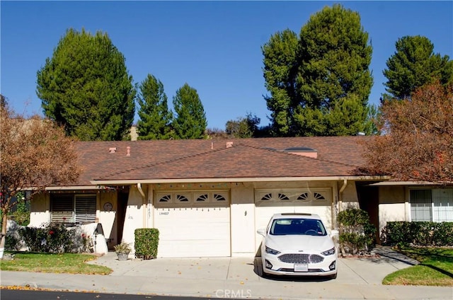 ranch-style home with a garage