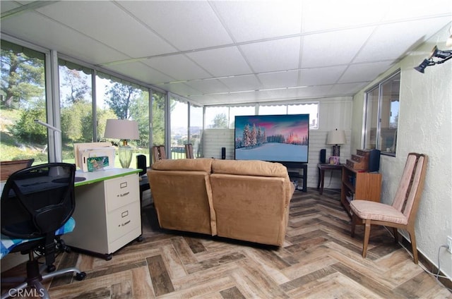 interior space featuring a paneled ceiling