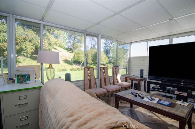 sunroom / solarium featuring a drop ceiling