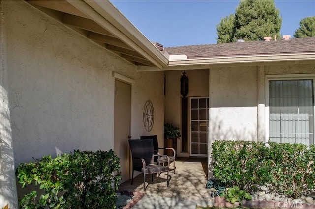 property entrance with a patio