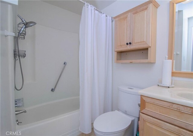 full bathroom with toilet, shower / bath combination with curtain, and vanity