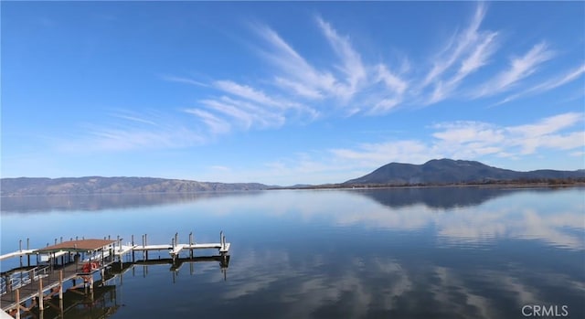 dock area featuring a water and mountain view