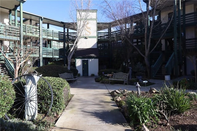 view of home's community with a patio area