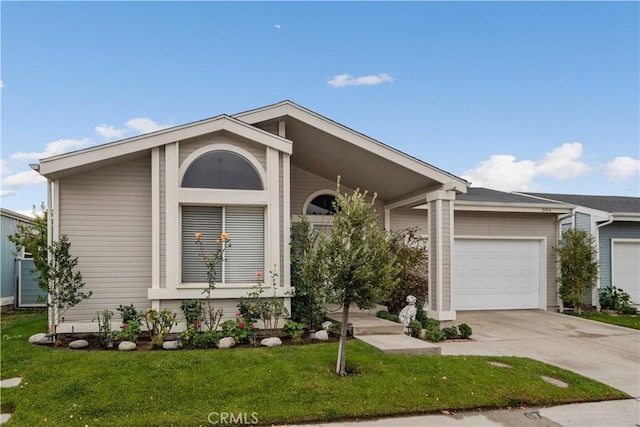 ranch-style house featuring a front yard and a garage