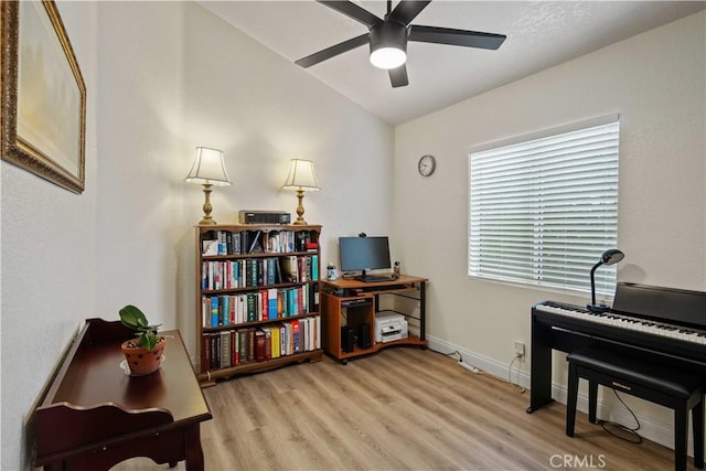 misc room with light wood-type flooring and ceiling fan