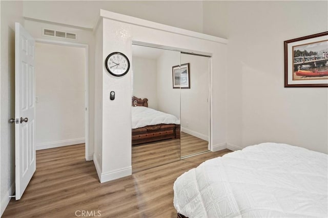 bedroom featuring a closet and wood-type flooring