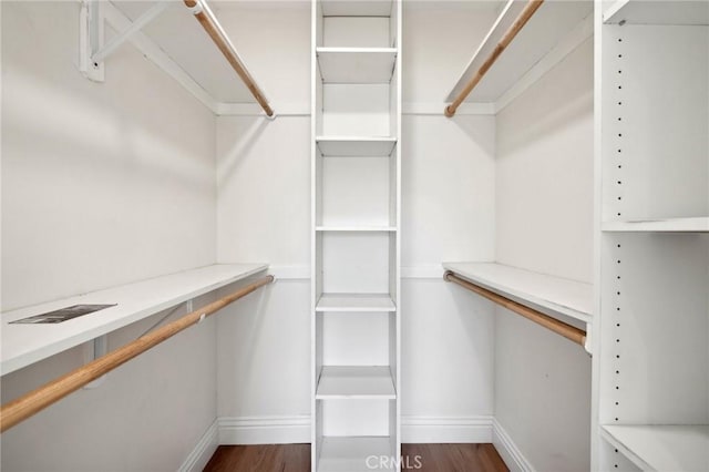 3821 S Muirfield Rd, Los Angeles, CA 90008 - walk in closet featuring dark wood-type flooring
