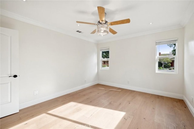 spare room with light wood-type flooring, ceiling fan, and crown molding