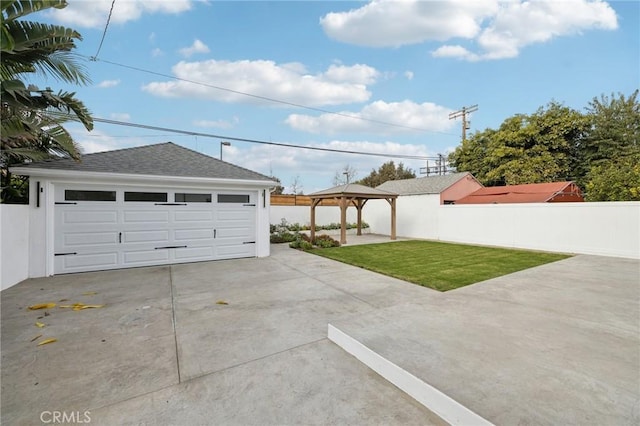 garage with a yard