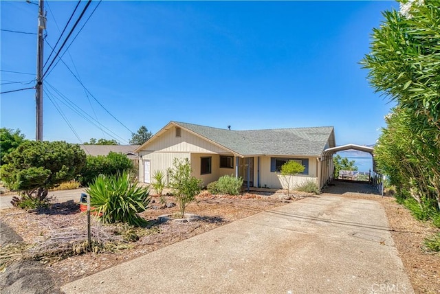 ranch-style home with a carport