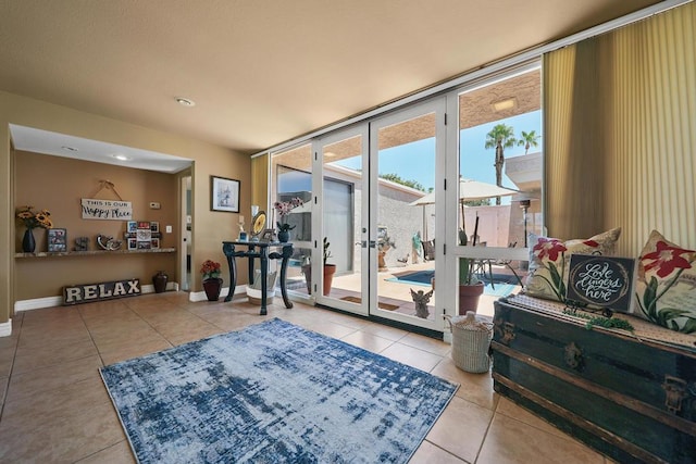 doorway featuring a wall of windows and tile patterned floors