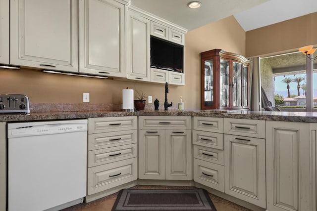 kitchen featuring white cabinets, white dishwasher, and kitchen peninsula