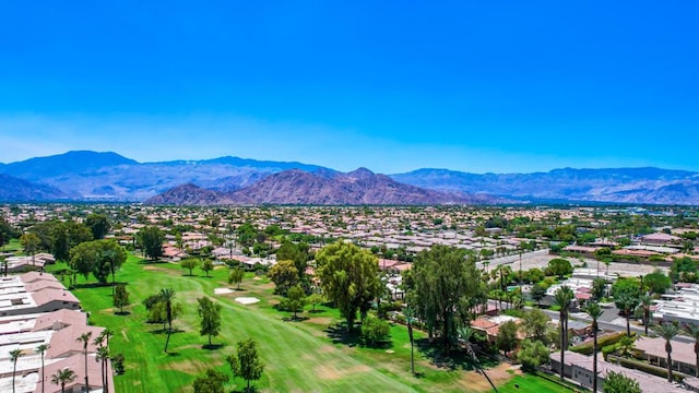 birds eye view of property with a mountain view