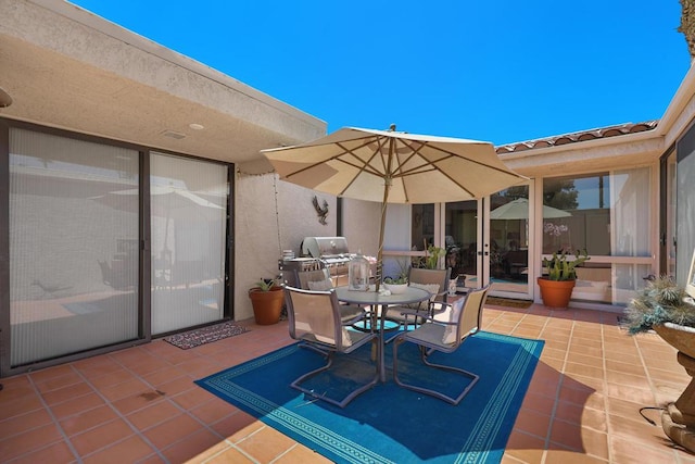 view of patio with a grill