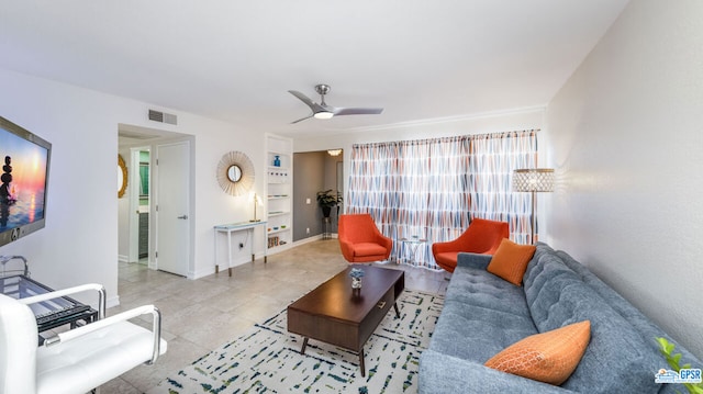 tiled living room with ceiling fan