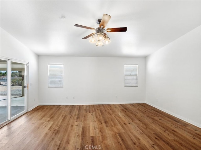 spare room featuring ceiling fan and light wood-type flooring