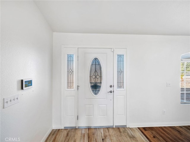 entrance foyer featuring hardwood / wood-style floors