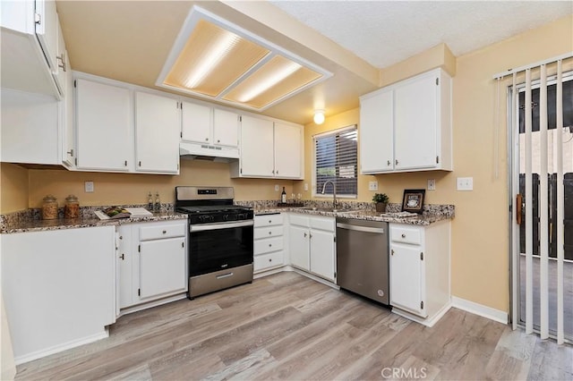 kitchen with white cabinets, sink, and stainless steel appliances