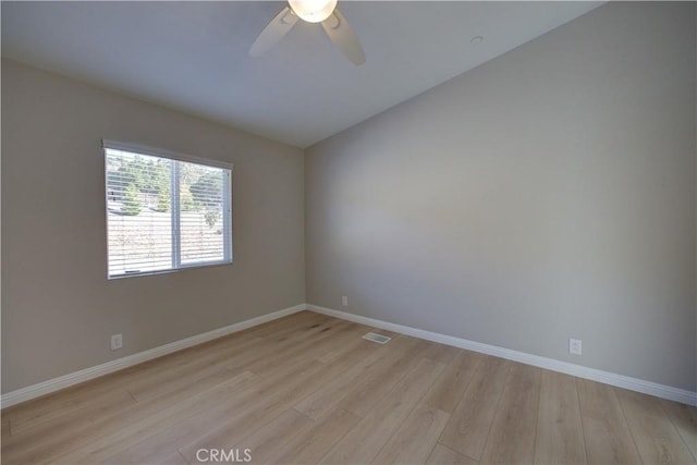 empty room with light hardwood / wood-style floors and ceiling fan