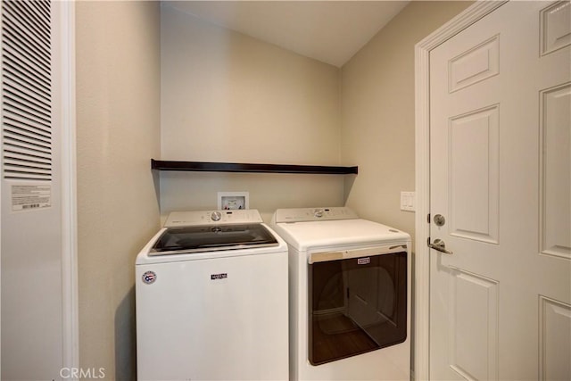 laundry area with washing machine and dryer