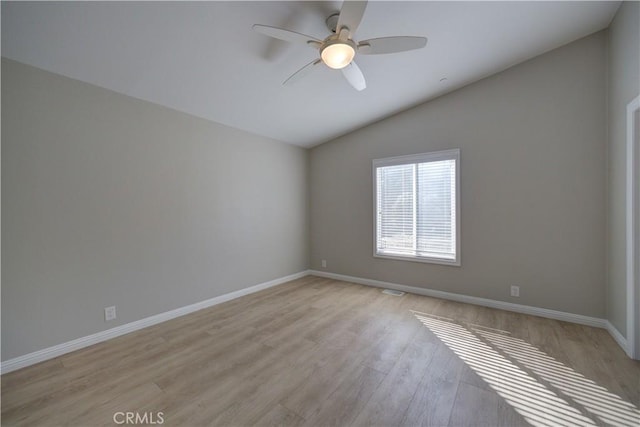 unfurnished room featuring light hardwood / wood-style floors, ceiling fan, and lofted ceiling