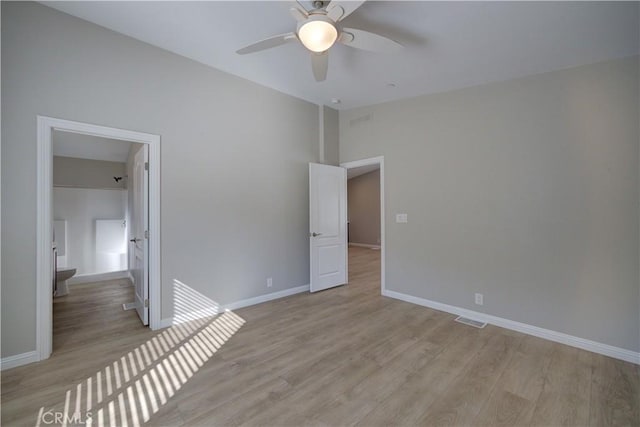 empty room featuring ceiling fan and light hardwood / wood-style flooring