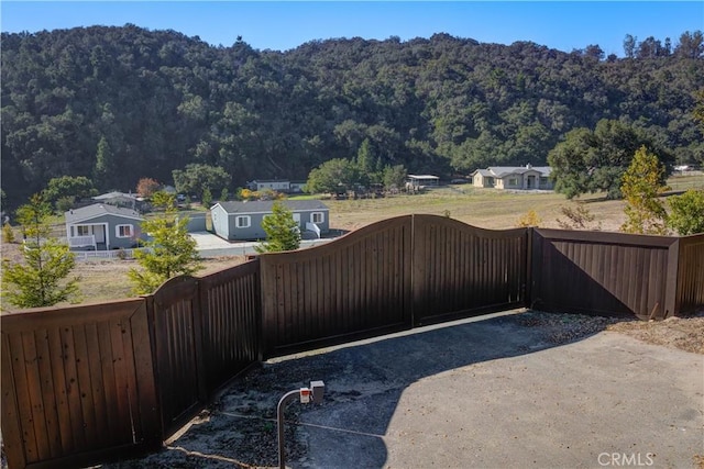 1592 Deer Canyon Rd, Arroyo Grande, CA 93420 - gate featuring fence, a forest view, and a mountain view