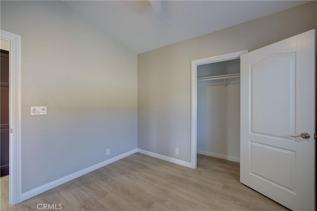 1592 Deer Canyon Rd, Arroyo Grande, CA 93420 - unfurnished bedroom with light wood-style flooring, a closet, baseboards, and vaulted ceiling