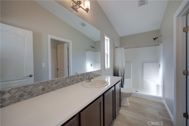 1592 Deer Canyon Rd, Arroyo Grande, CA 93420 - full bathroom featuring vaulted ceiling, a shower with shower curtain, wood finished floors, toilet, and vanity