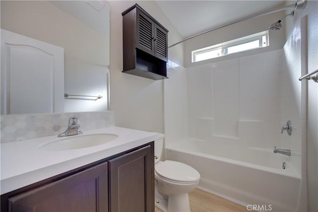 full bathroom featuring vanity,  shower combination, hardwood / wood-style flooring, and toilet