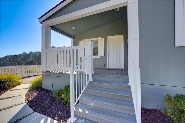 doorway to property featuring covered porch