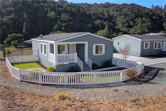 1592 Deer Canyon Rd, Arroyo Grande, CA 93420 - view of front of house featuring a porch and a forest view