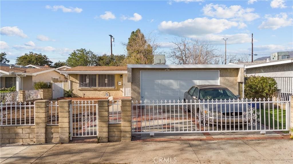 ranch-style house featuring a garage