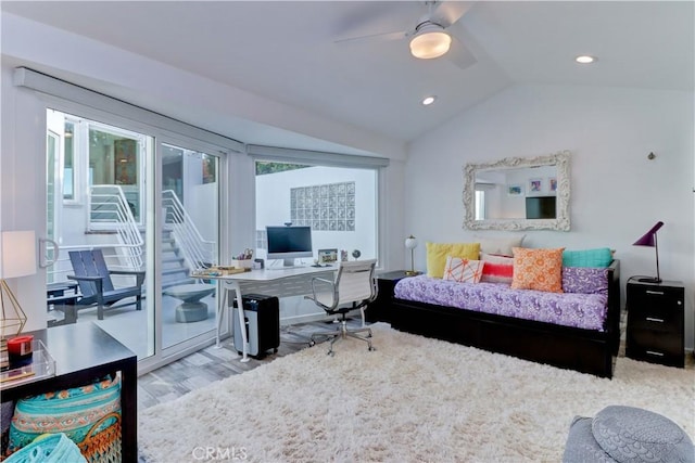 bedroom with vaulted ceiling, ceiling fan, light hardwood / wood-style floors, and access to outside