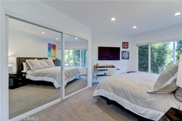 bedroom with light colored carpet