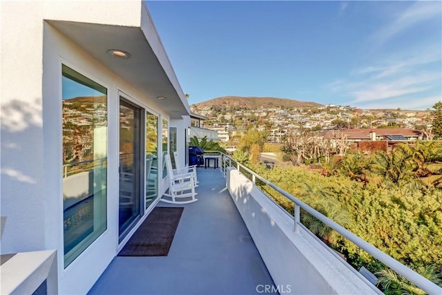 balcony featuring a mountain view