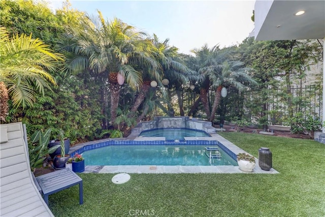 view of pool with an in ground hot tub and a yard