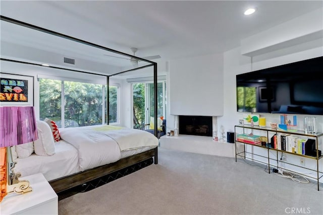 bedroom with ceiling fan and carpet floors