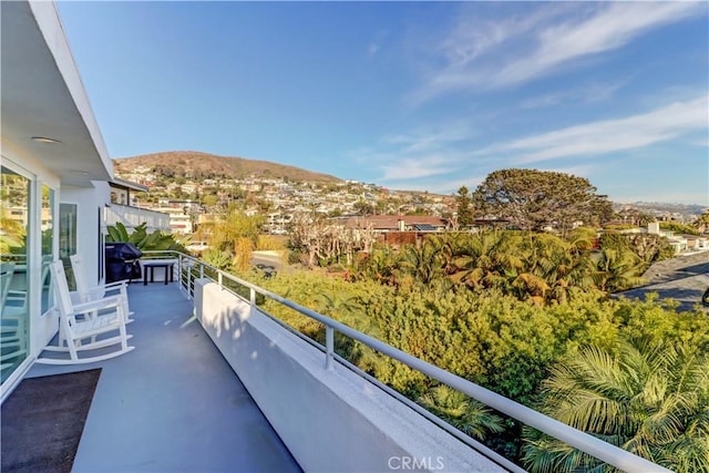 balcony featuring a mountain view