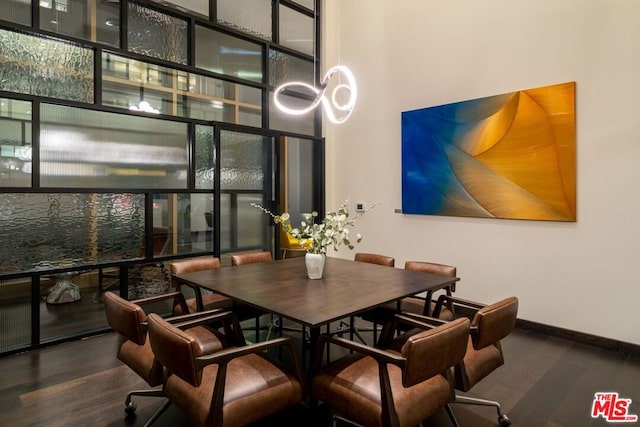 dining space featuring dark wood-type flooring