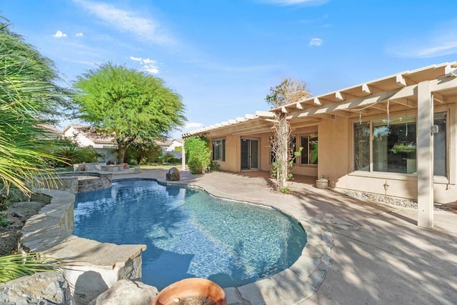 view of pool with an in ground hot tub and a patio area