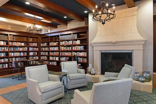 sitting room featuring a large fireplace and beamed ceiling