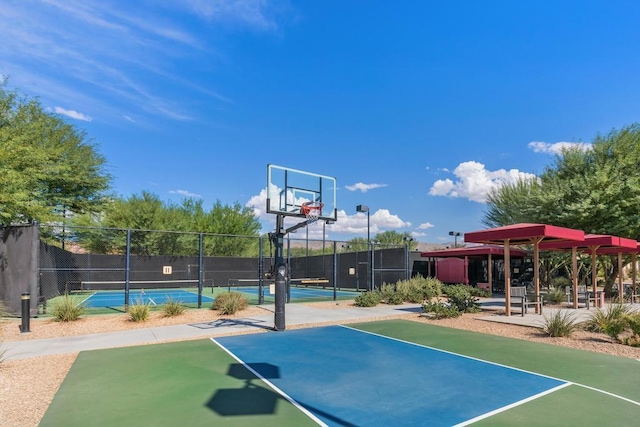 view of basketball court featuring tennis court