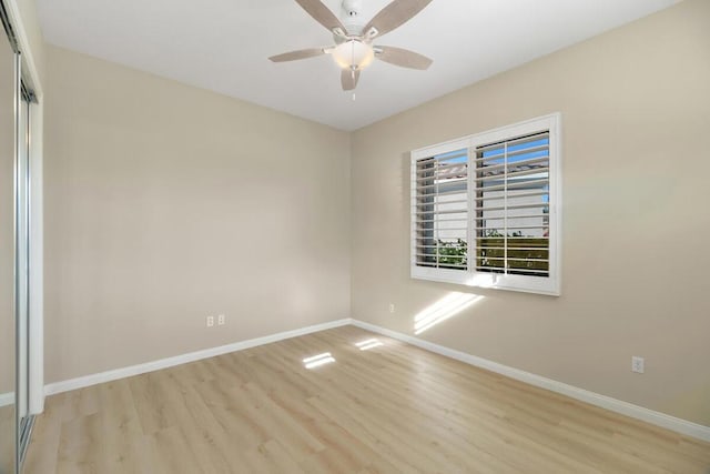 spare room with ceiling fan and light hardwood / wood-style flooring