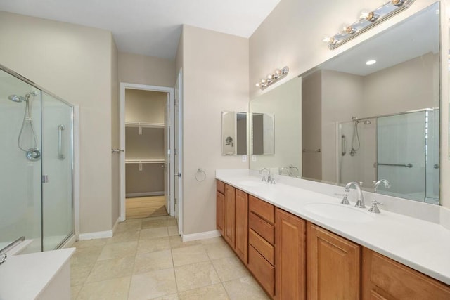 bathroom with vanity, tile patterned floors, and an enclosed shower