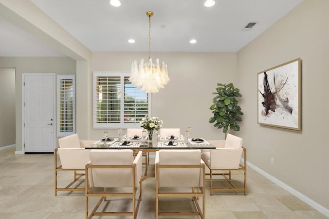 dining area featuring a chandelier