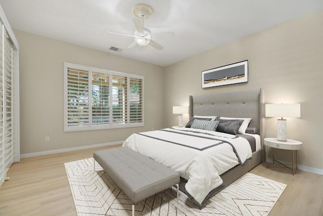 bedroom featuring light wood-type flooring and ceiling fan