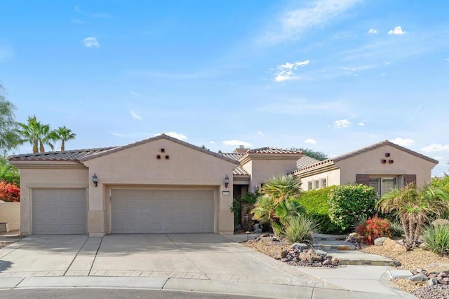 mediterranean / spanish-style house featuring a garage