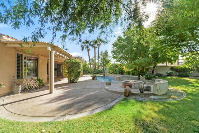 view of yard with a patio area and a fire pit